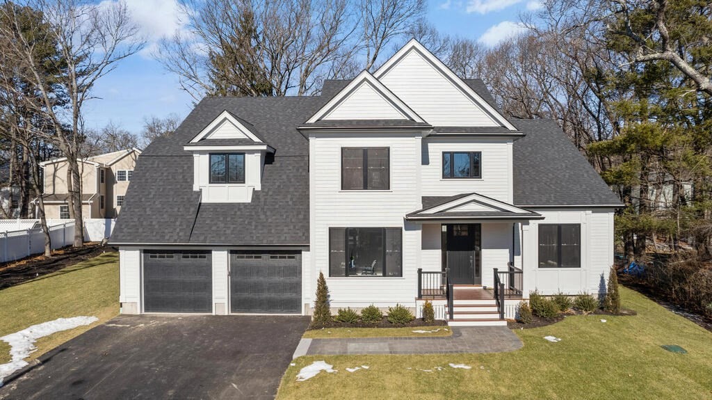 40 Bridge Street Lexington, MA 02421 - Photo 40 of 42 a front view of a house with a yard
