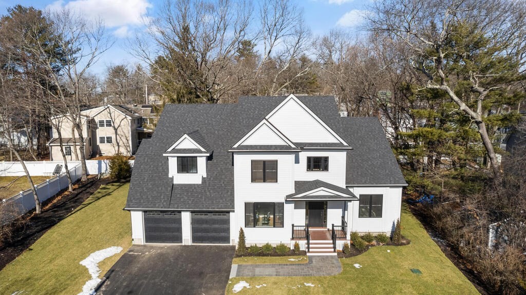 40 Bridge Street Lexington, MA 02421 - Photo 41 of 42 a front view of a house with a yard