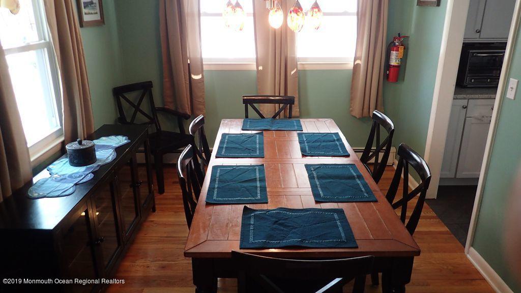 20 McClintock Street Ocean Grove, NJ 07756 - Photo 12 of 19 a living room with furniture rug and a window