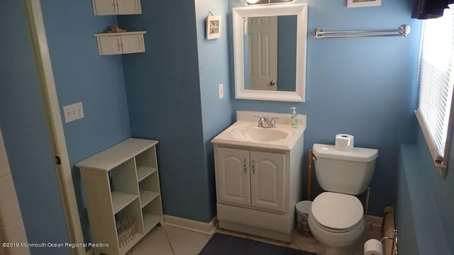 a bathroom with a toilet and a sink