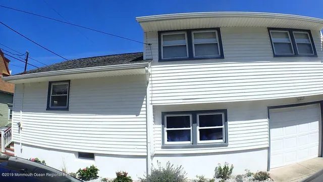 a view of a house with large windows