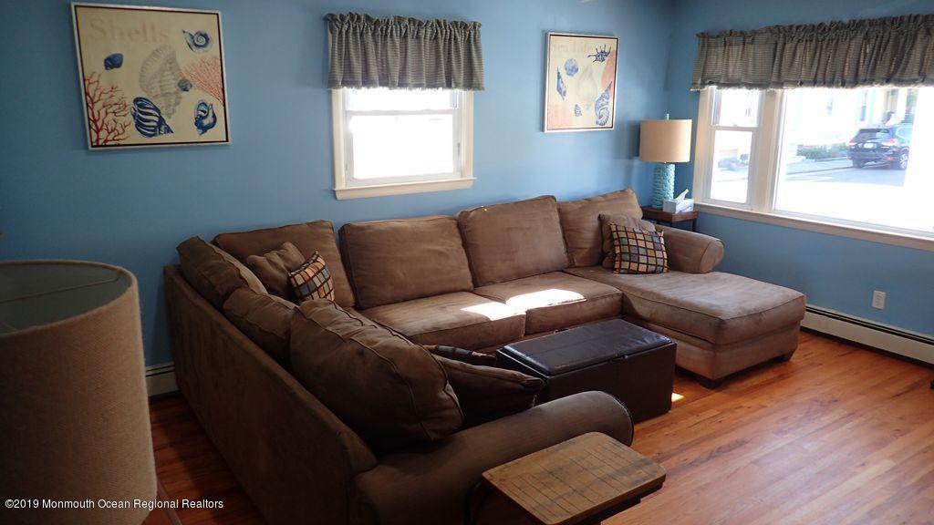 20 McClintock Street Ocean Grove, NJ 07756 - Photo 5 of 19 a living room with furniture and a large window