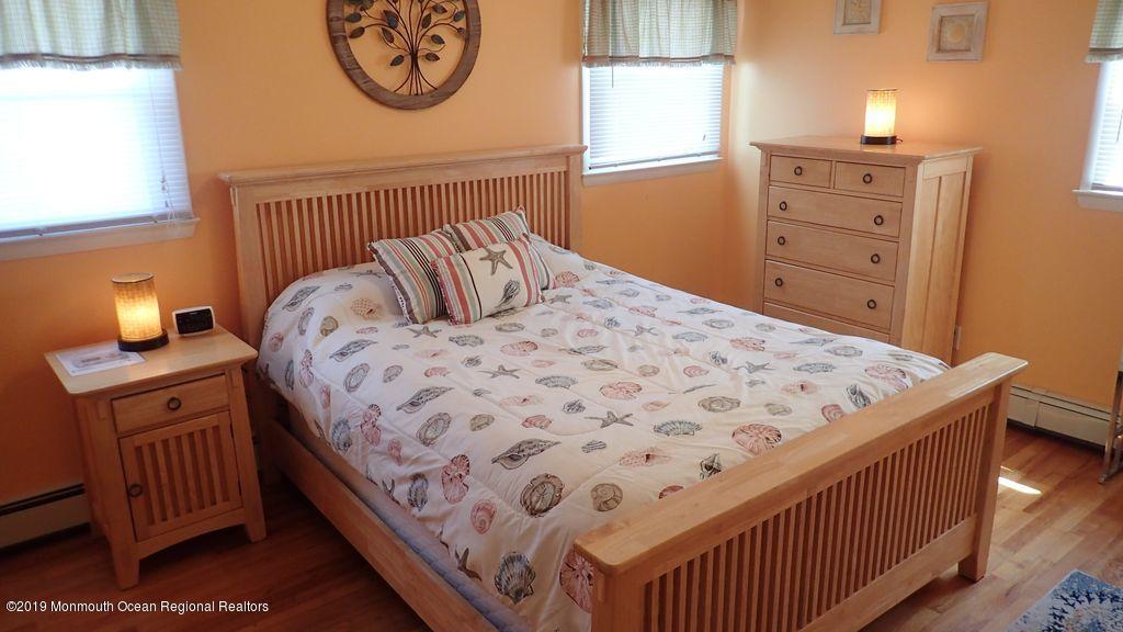 20 McClintock Street Ocean Grove, NJ 07756 - Photo 7 of 19 a bedroom with a bed and a window