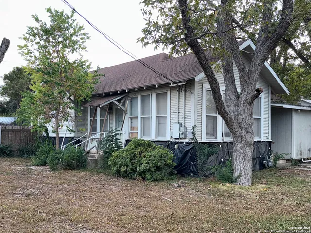 a house with a tree in front of it