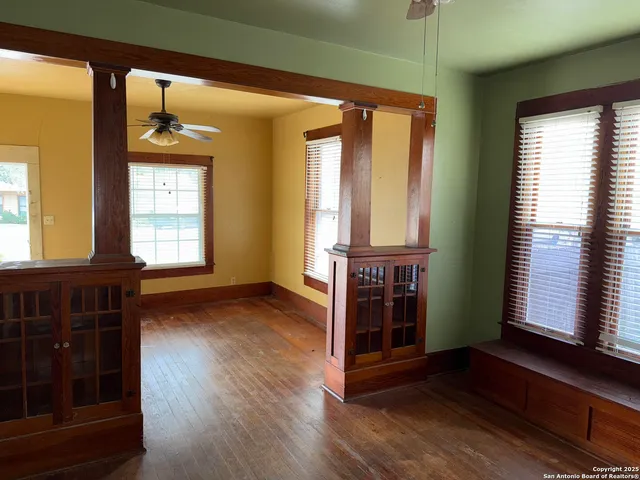 a view of an entryway with wooden floor and windows