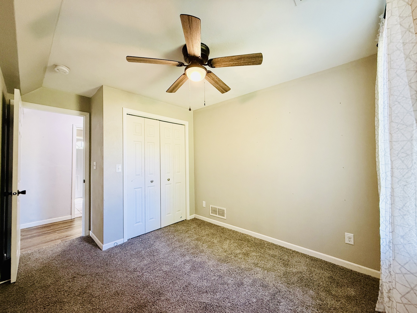 715 8th Street Colona, IL 61241 - Photo 6 of 14 a view of a room with a ceiling fan