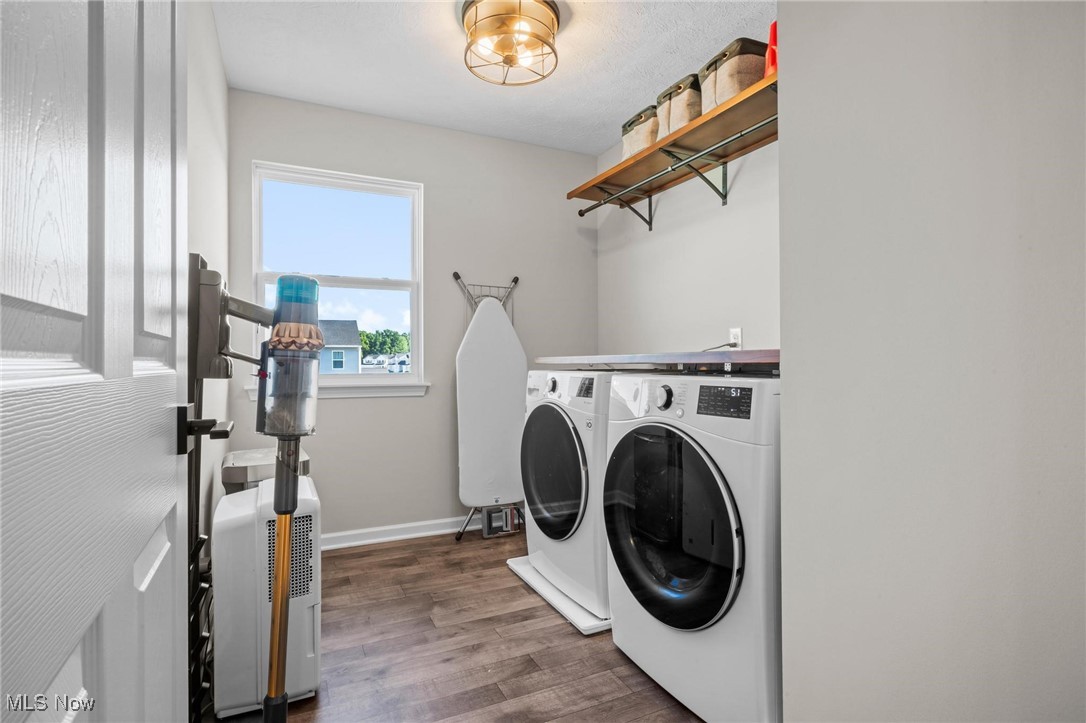 37174 Amber Way North Ridgeville, OH 44039 - Photo 22 of 40 Laundry area featuring washer and clothes dryer and wood finished floors
