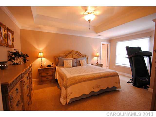 3228 Williams Station Road Matthews, NC 28105 - Photo 11 of 16 a bedroom with a bed and wooden floor