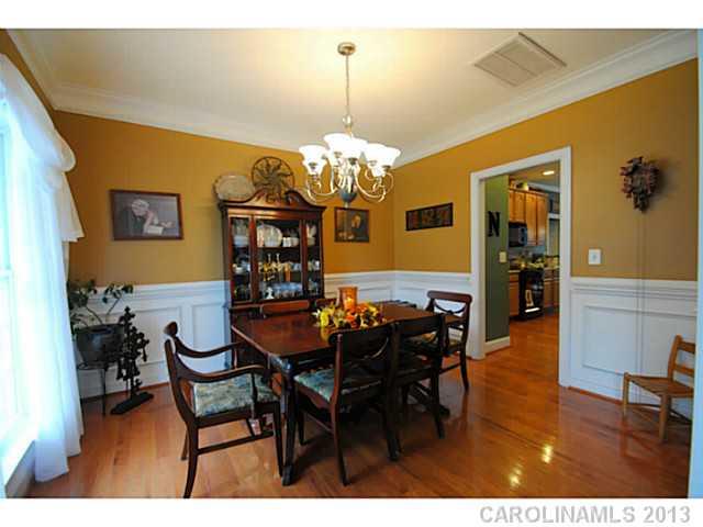 3228 Williams Station Road Matthews, NC 28105 - Photo 4 of 16 a view of a dining room with furniture and chandelier