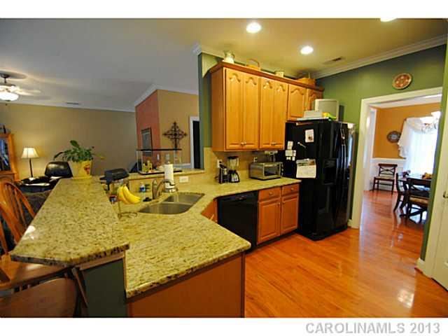 3228 Williams Station Road Matthews, NC 28105 - Photo 9 of 16 a kitchen with sink and refrigerator