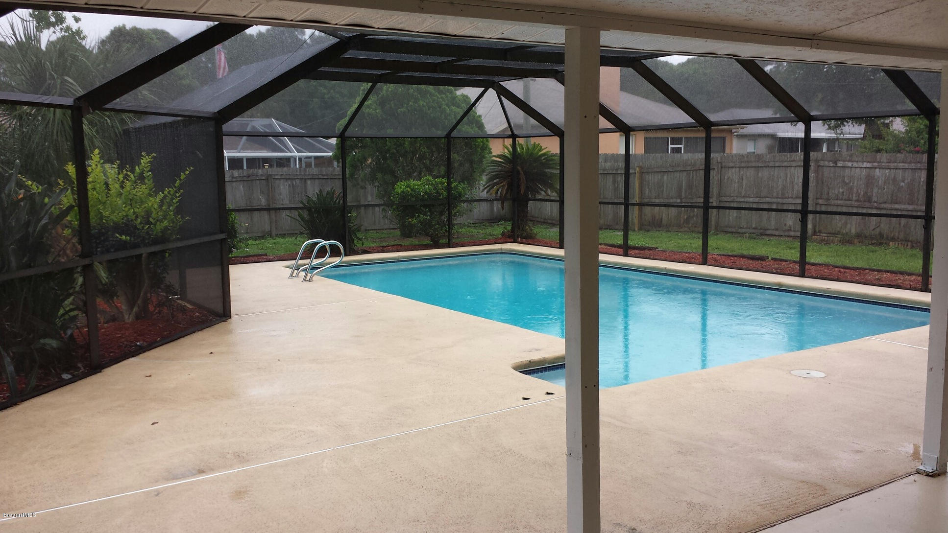 6965 Bryant Road Cocoa, FL 32927 - Photo 12 of 12 a view of a swimming pool