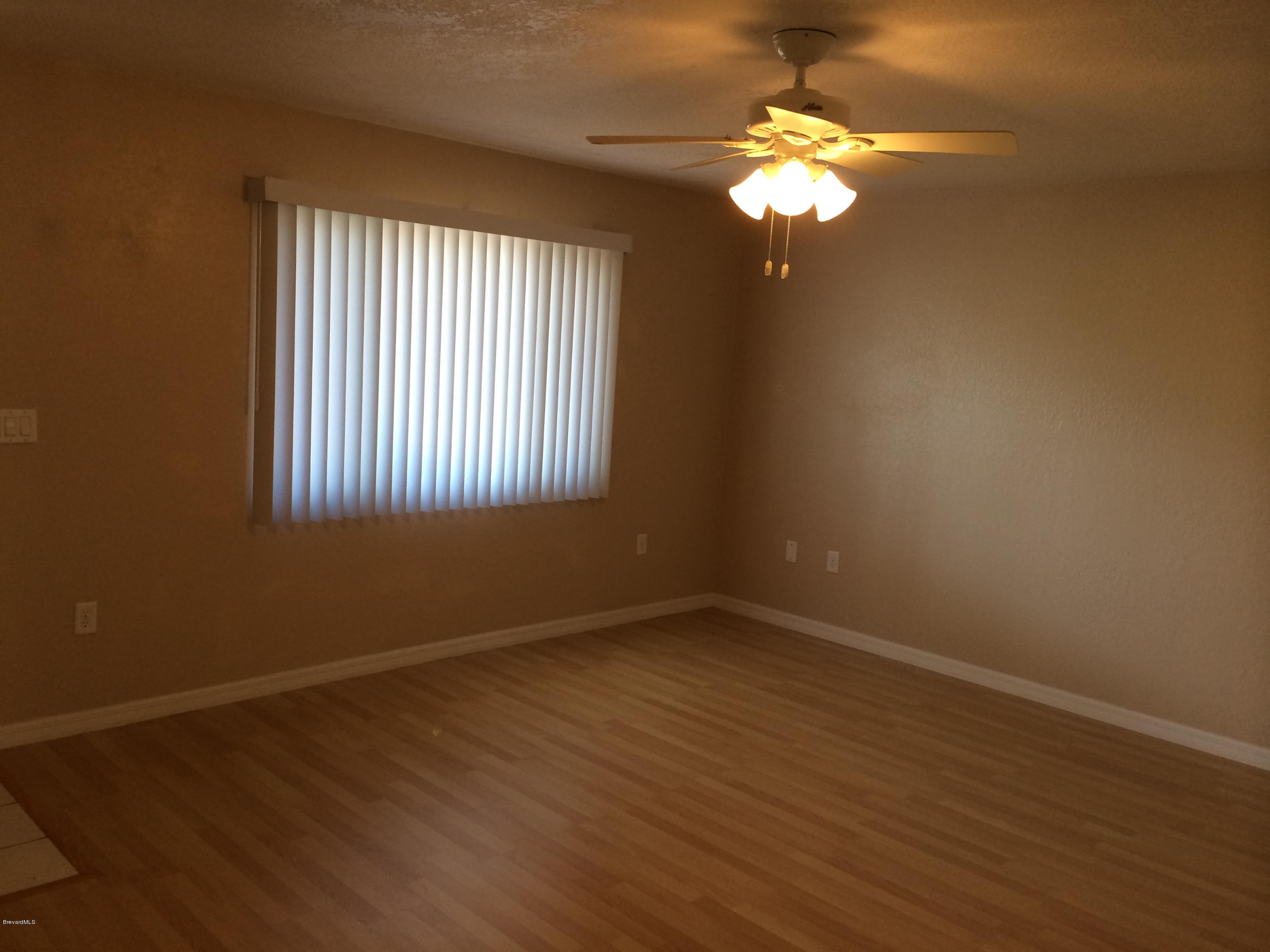 6965 Bryant Road Cocoa, FL 32927 - Photo 4 of 12 a view of a livingroom with a window