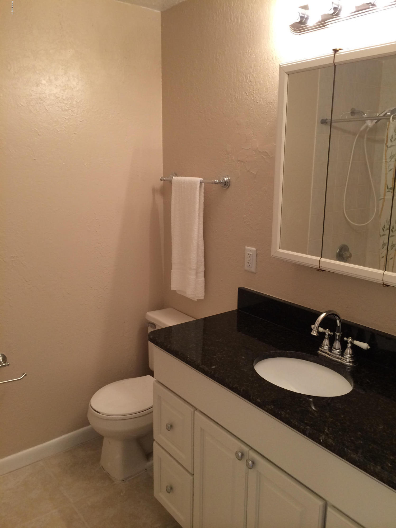 6965 Bryant Road Cocoa, FL 32927 - Photo 7 of 12 a bathroom with a granite countertop sink and a mirror