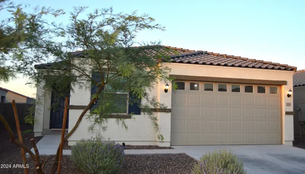 a view of a house with a tree