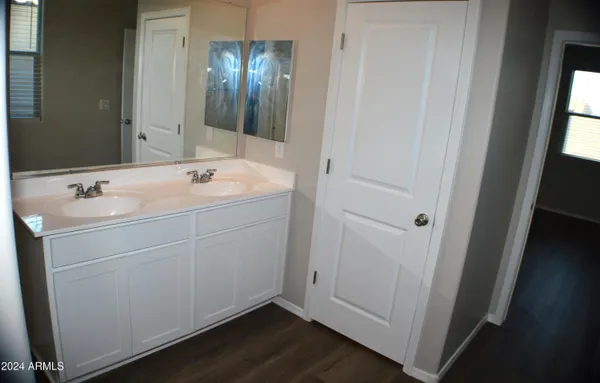 an entryway with wooden floor