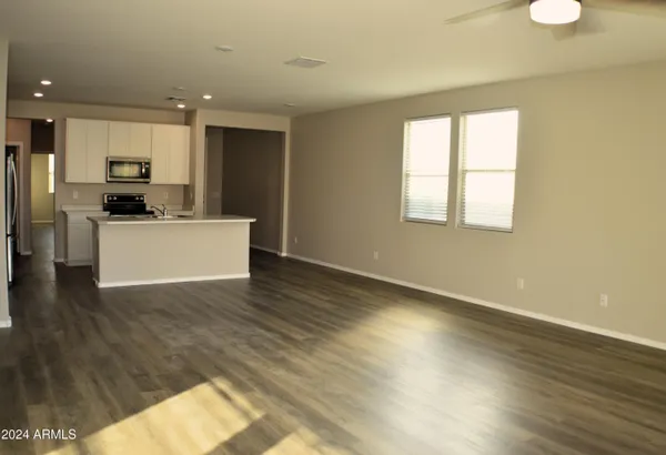 a view of kitchen with sink and wooden floor