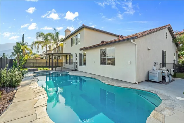a swimming pool with outdoor seating yard and livingroom view