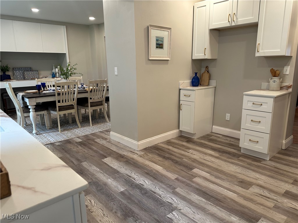 13707 Drexmore Road Cleveland, OH 44120 - Photo 3 of 35 Kitchen featuring wood finished floors, recessed lighting, white cabinets, and baseboards