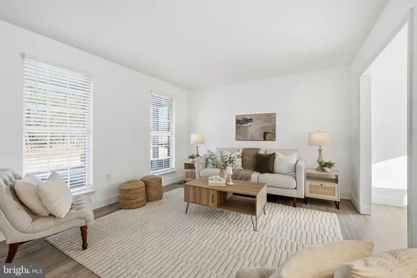a bedroom with furniture and wooden floor