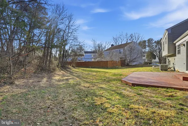 a view of a yard with swimming pool
