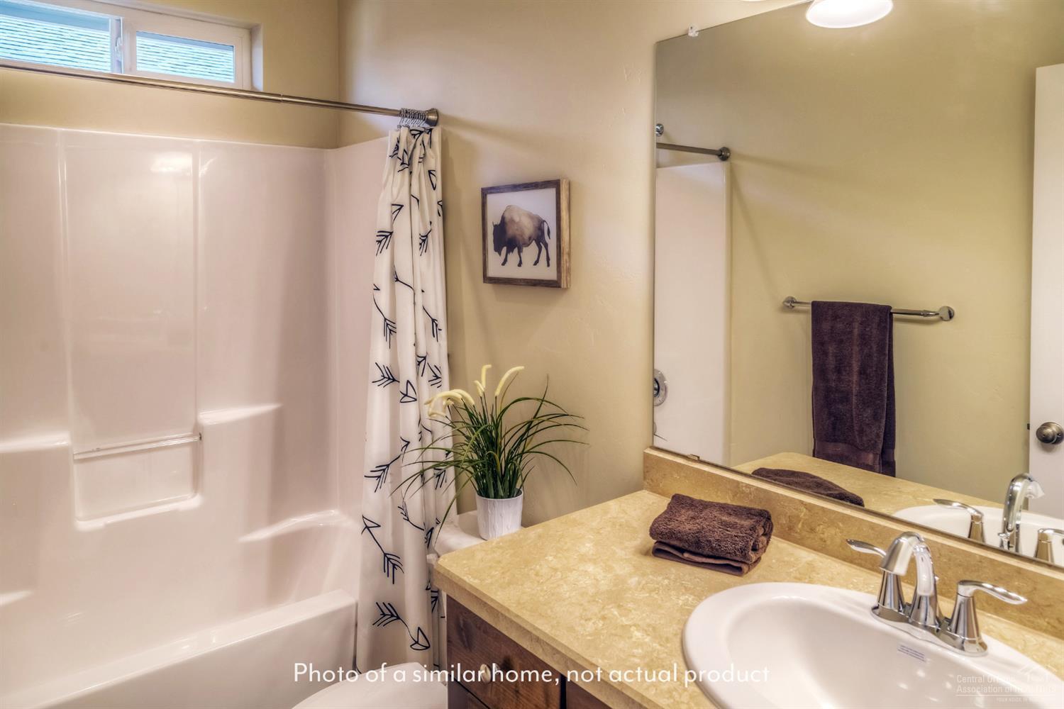 2547 Northeast Apollo Road Prineville, OR 97754 - Photo 5 of 9 a bathroom with a granite countertop sink and a mirror