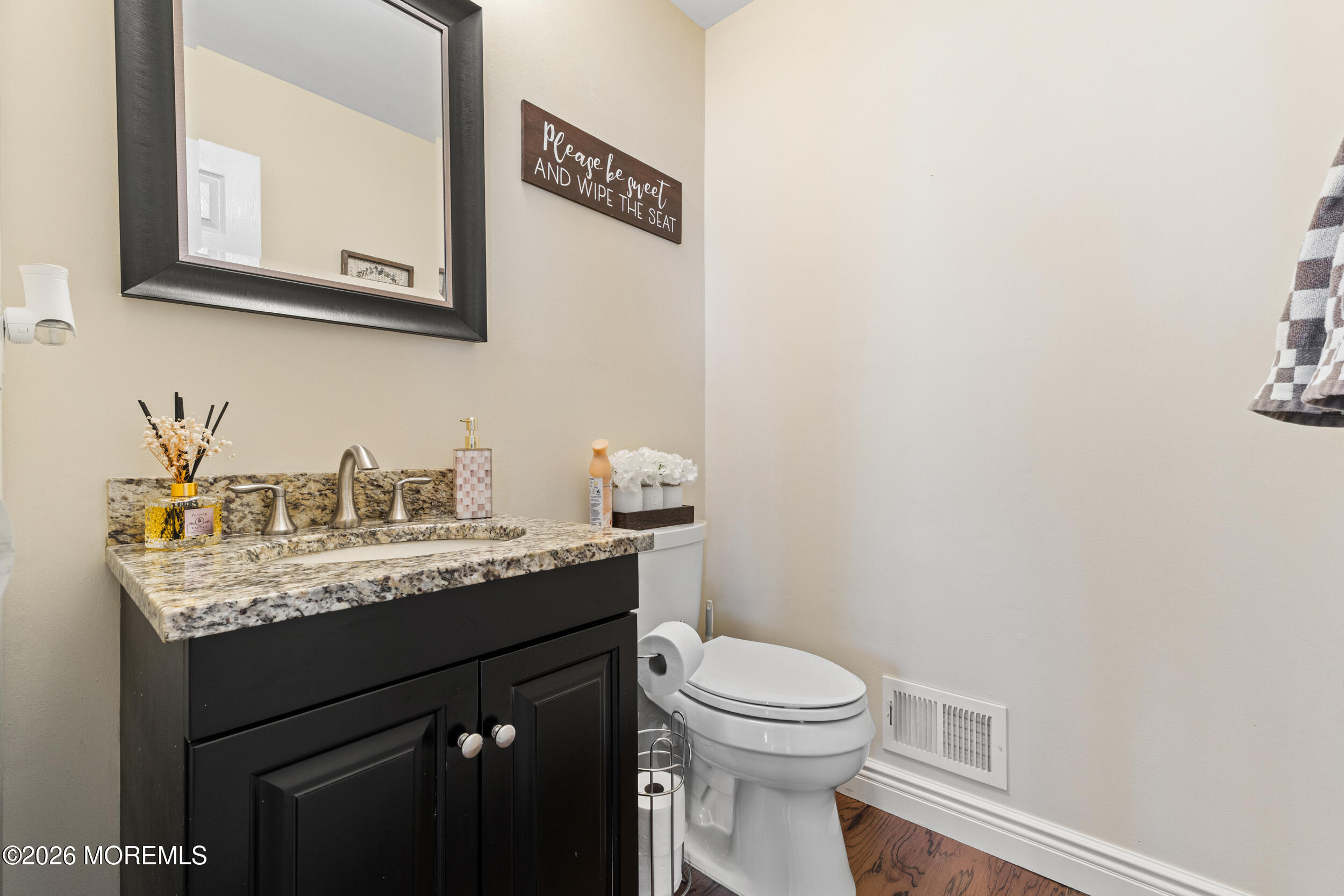 126 Wainwright Drive Old Bridge, NJ 07747 - Photo 23 of 54 a bathroom with a granite countertop sink a mirror and a toilet