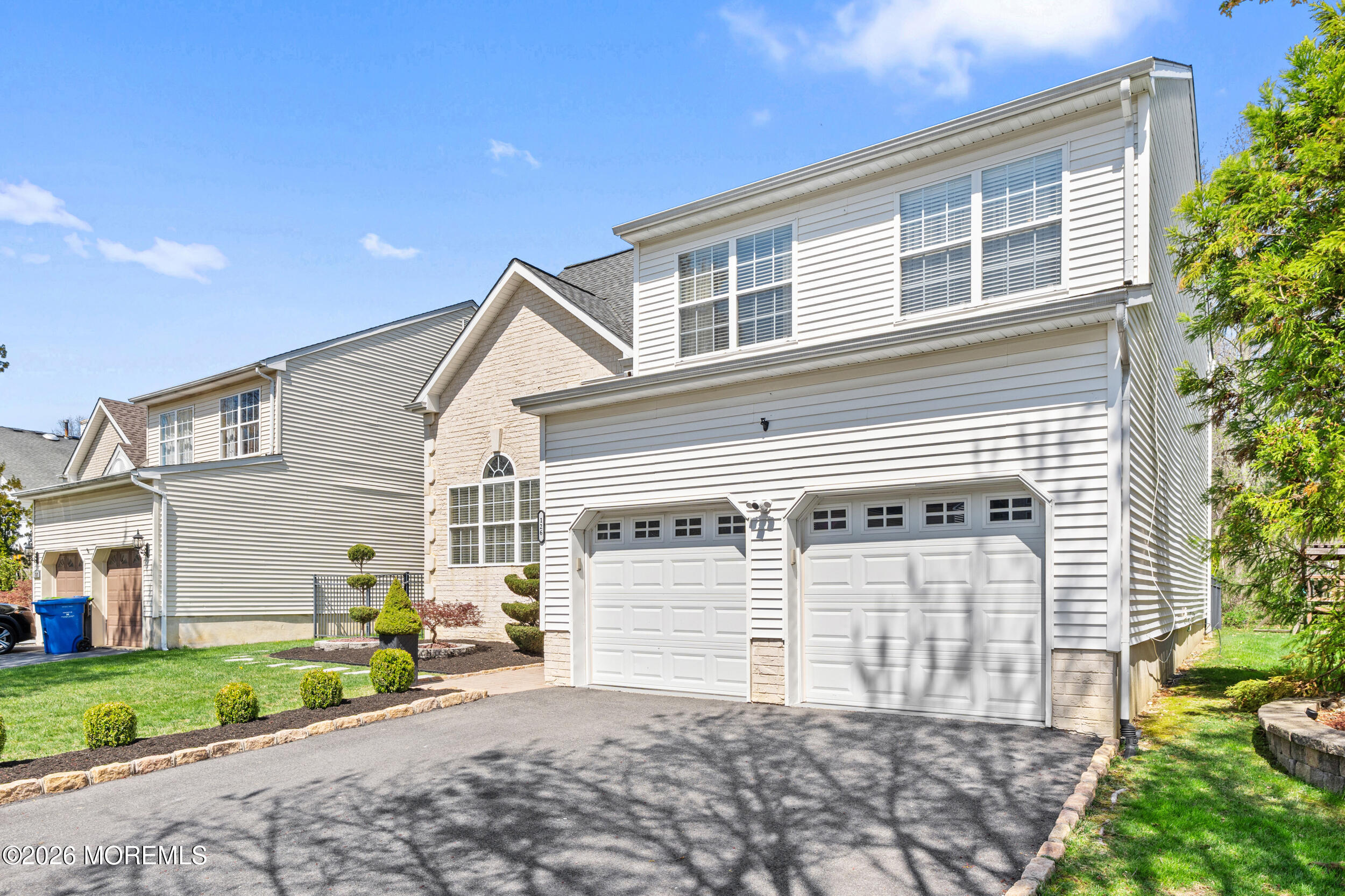 126 Wainwright Drive Old Bridge, NJ 07747 - Photo 3 of 54 a front view of a house with a yard and garage