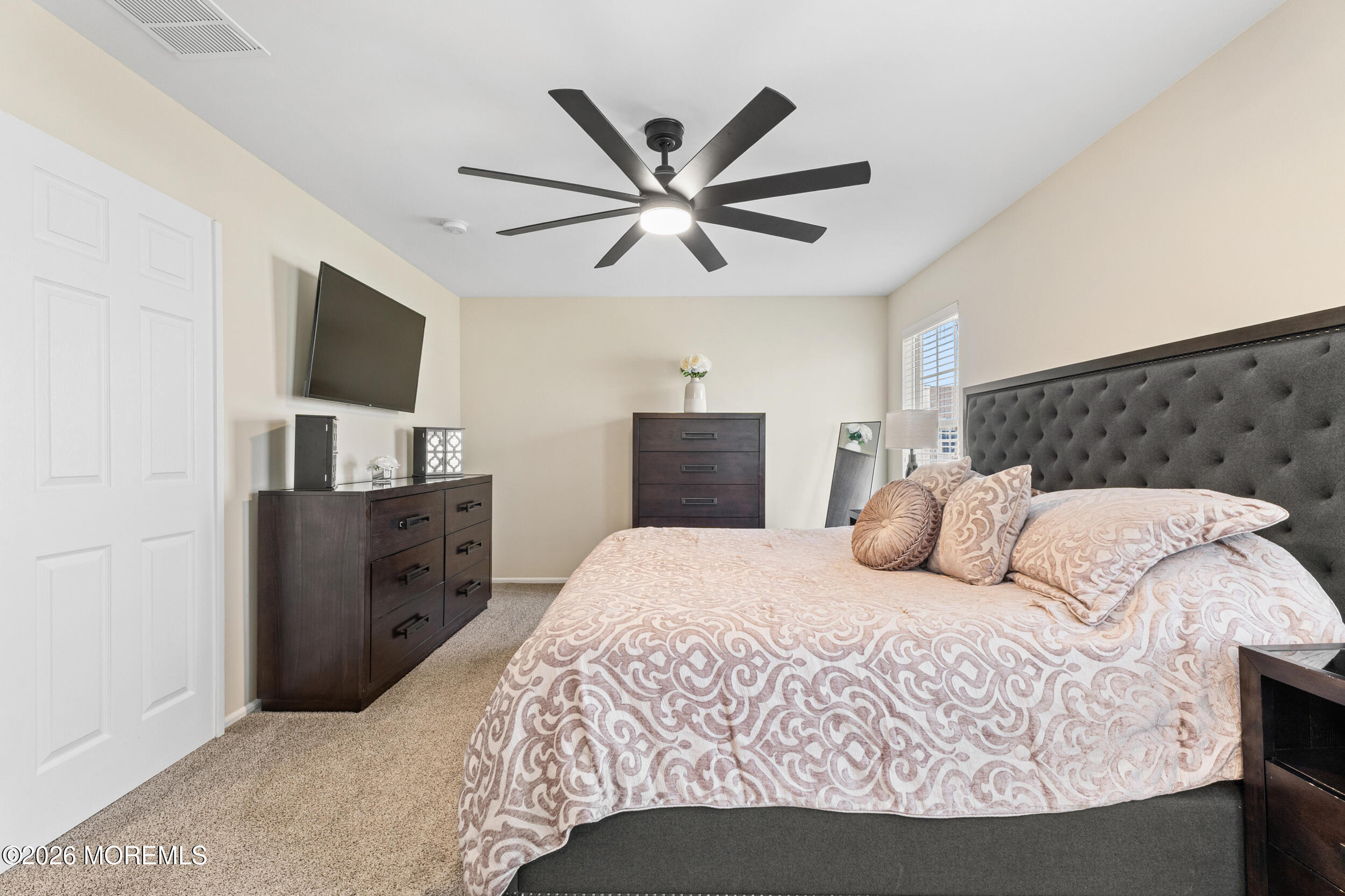 126 Wainwright Drive Old Bridge, NJ 07747 - Photo 31 of 54 a bedroom with a bed and a television