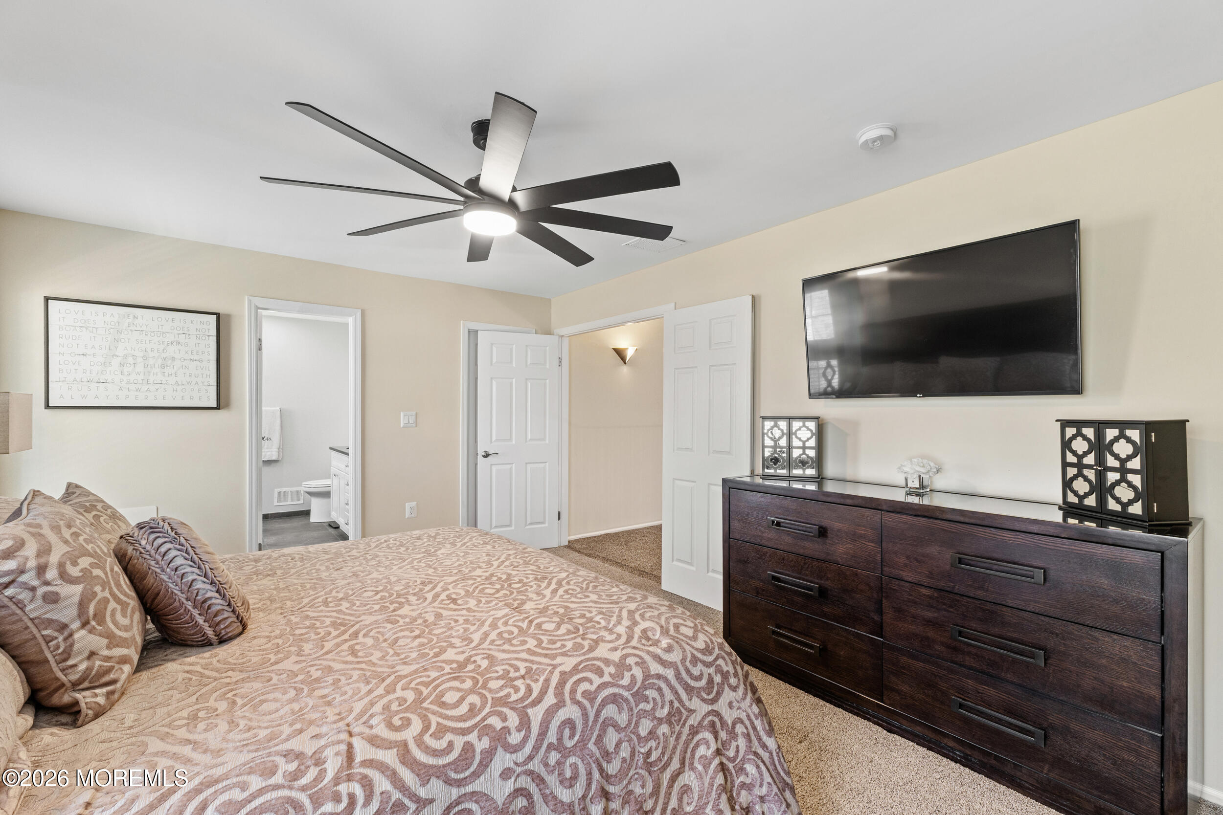 126 Wainwright Drive Old Bridge, NJ 07747 - Photo 32 of 54 a bedroom with a large bed and a flat screen tv