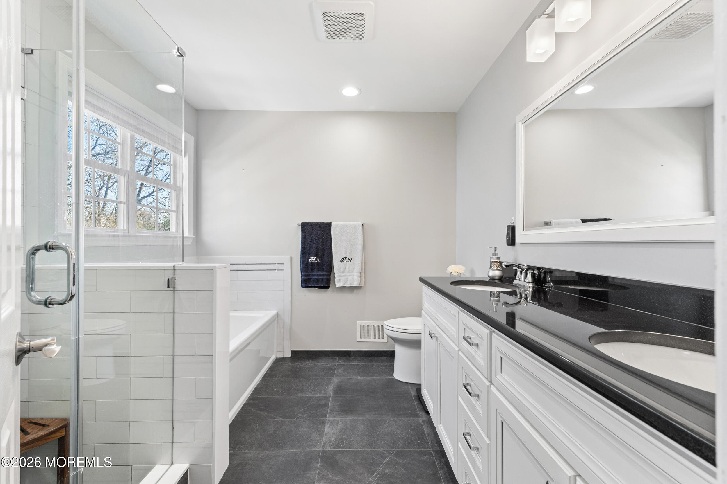 126 Wainwright Drive Old Bridge, NJ 07747 - Photo 33 of 54 a spacious bathroom with a sink a large mirror and a toilet