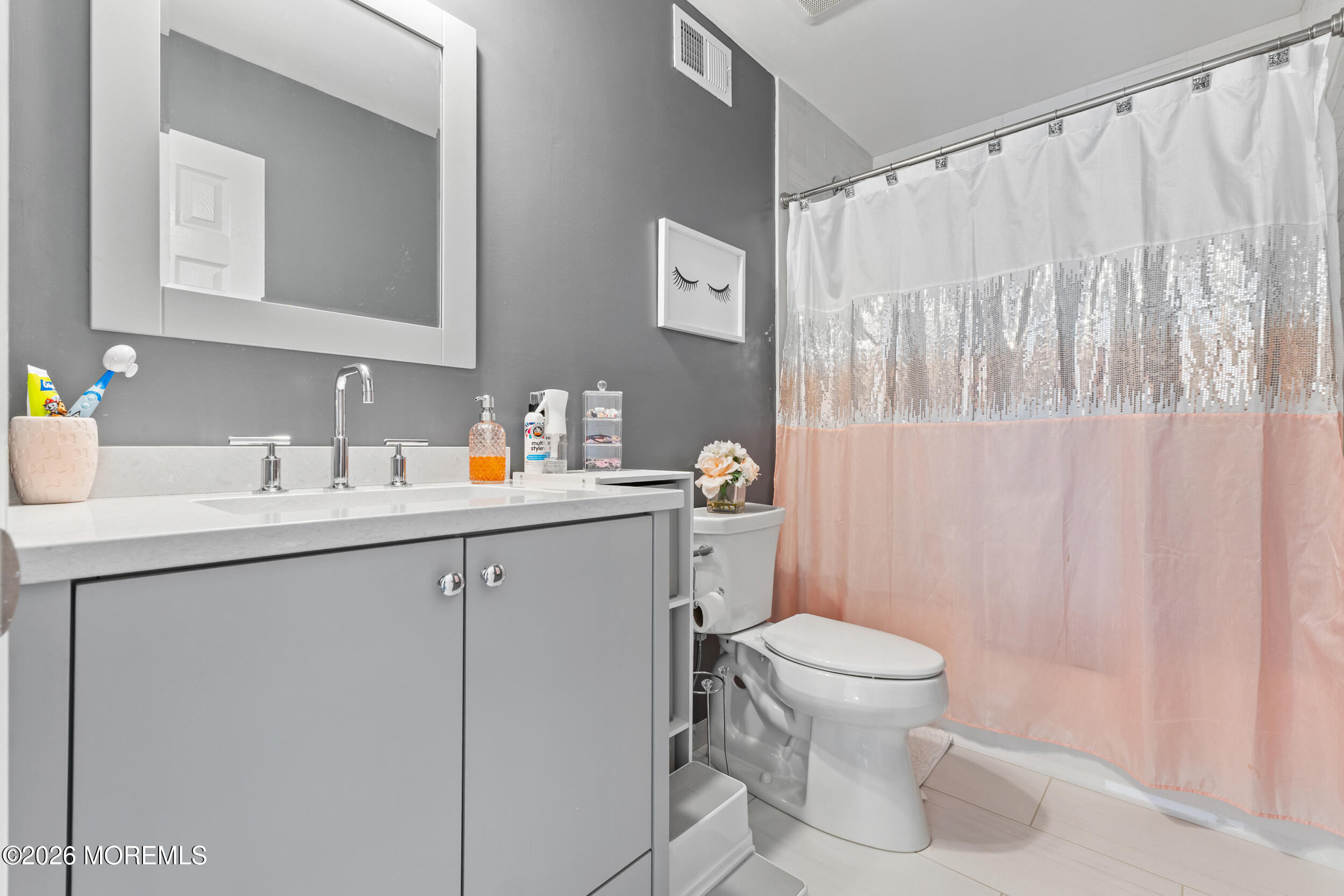 126 Wainwright Drive Old Bridge, NJ 07747 - Photo 38 of 54 a bathroom with a sink a toilet and a mirror