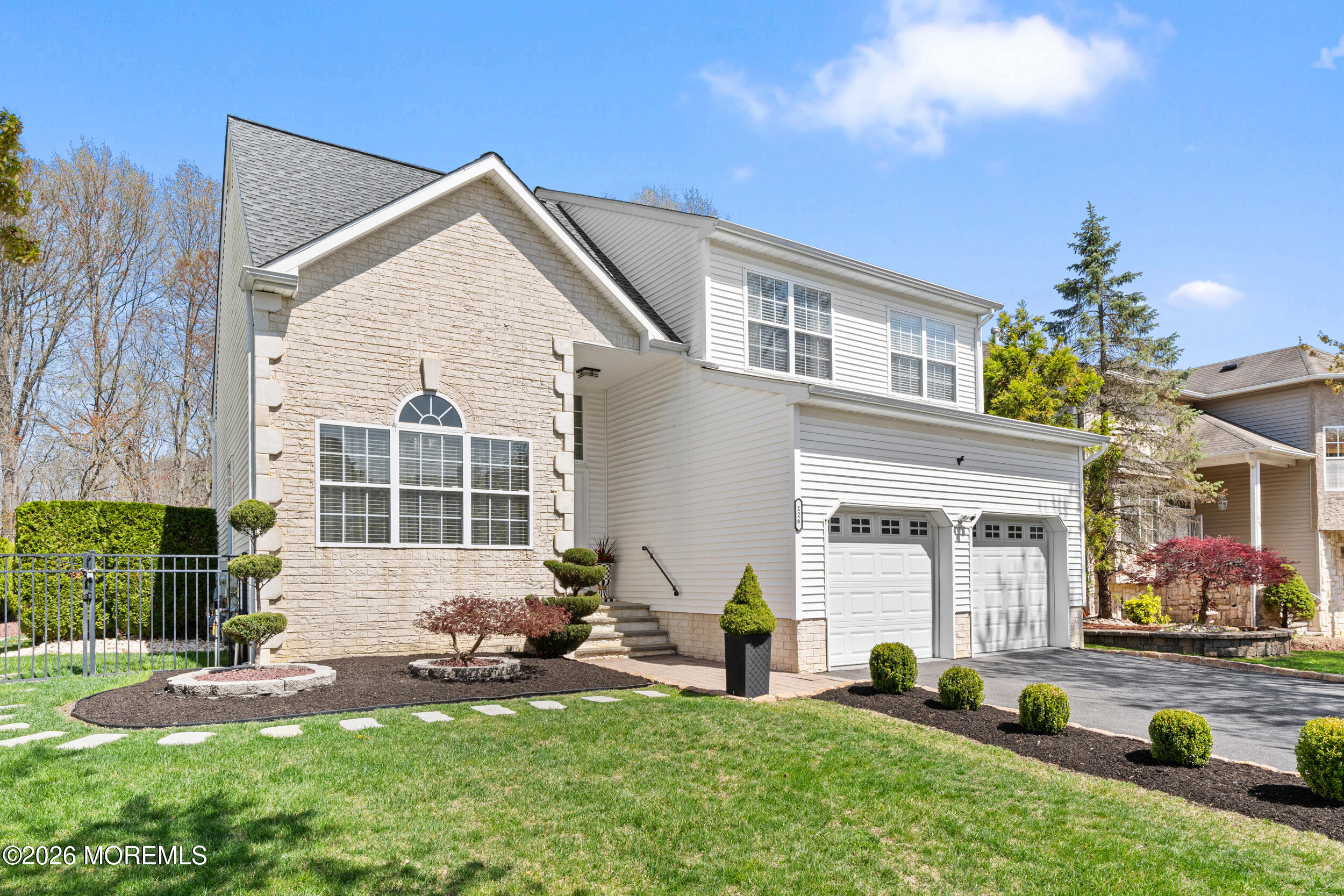 126 Wainwright Drive Old Bridge, NJ 07747 - Photo 4 of 54 a front view of a house with a yard and outdoor seating