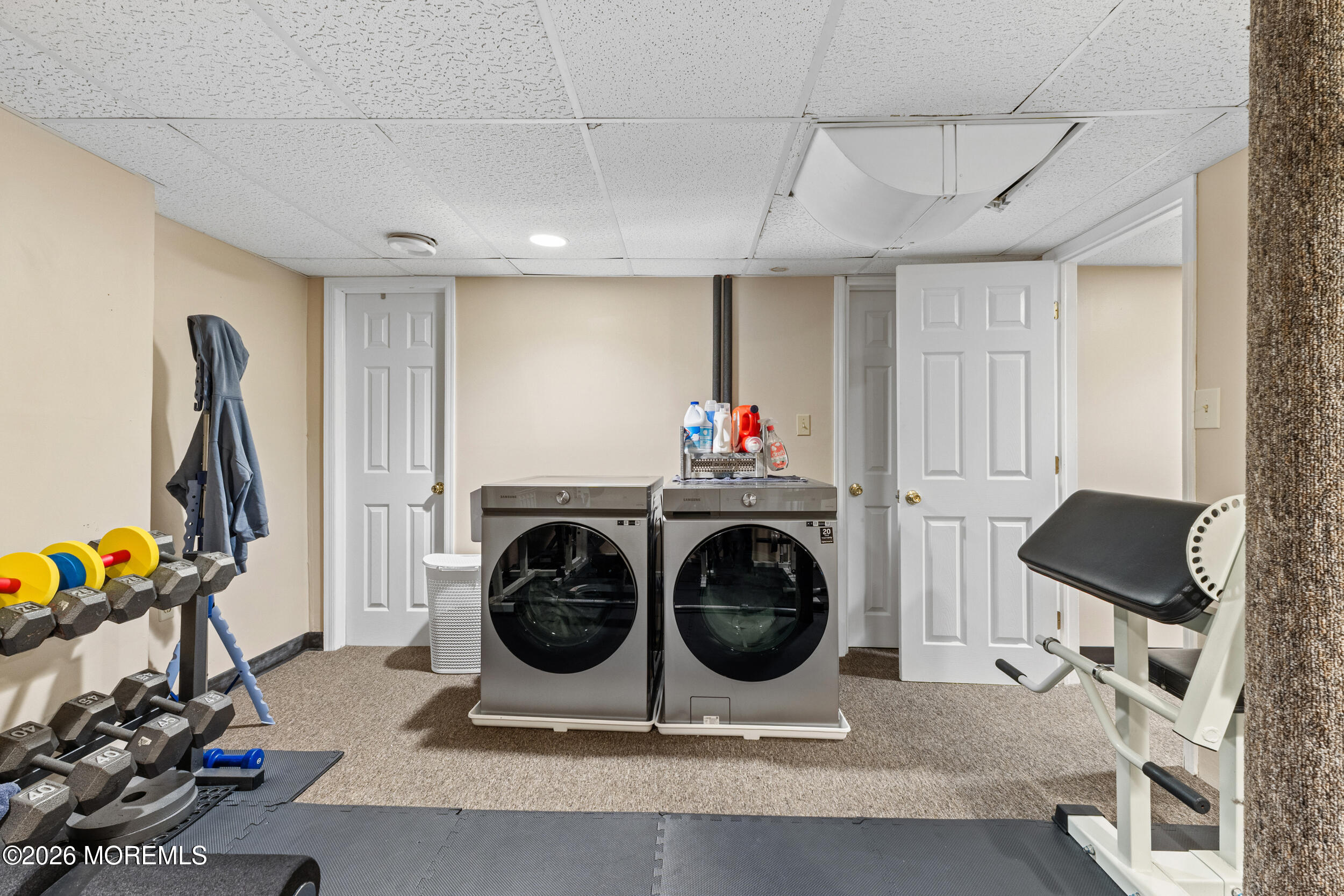 126 Wainwright Drive Old Bridge, NJ 07747 - Photo 43 of 54 a utility room with dryer washer and a view of living room