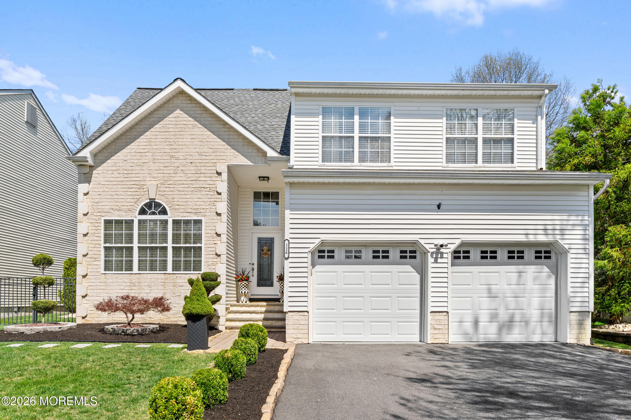 126 Wainwright Drive Old Bridge, NJ 07747 - Photo 53 of 54 a front view of a house with a yard and garage