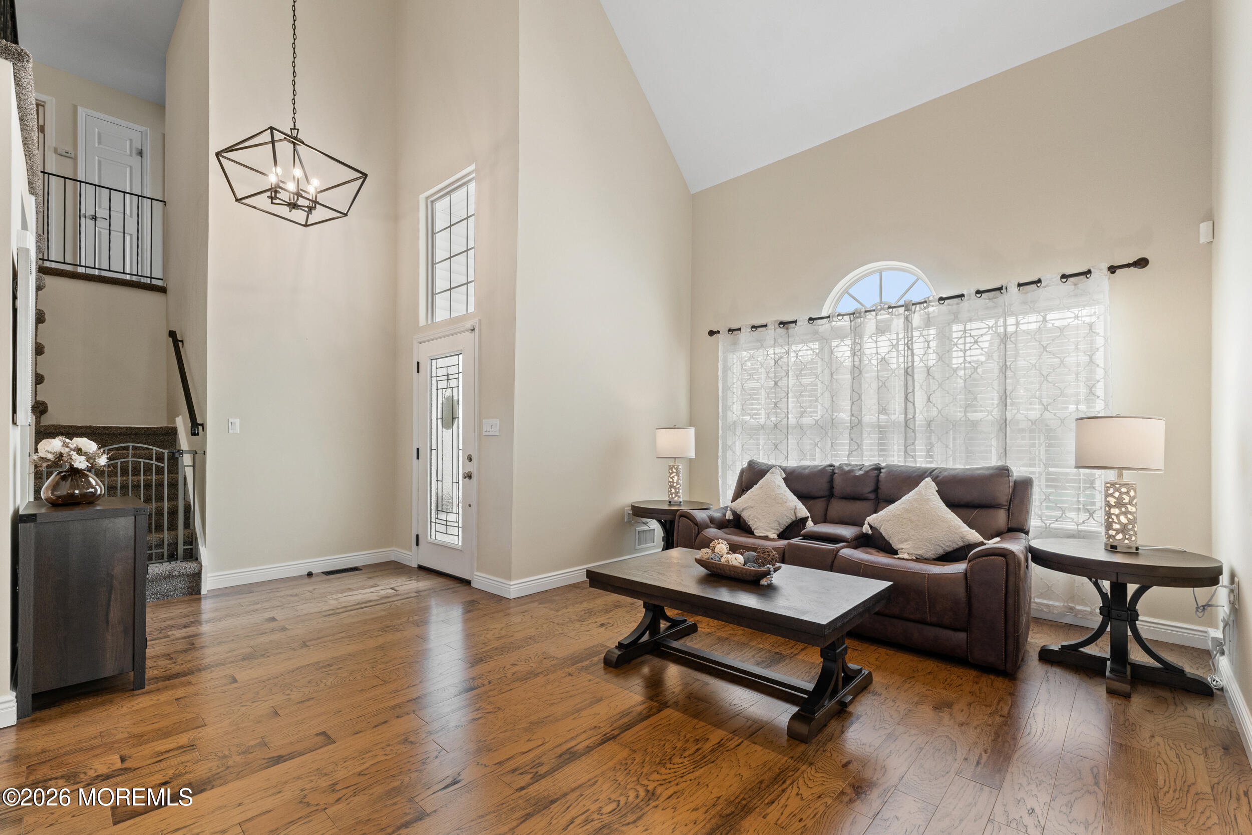126 Wainwright Drive Old Bridge, NJ 07747 - Photo 7 of 54 a living room with furniture and a chandelier