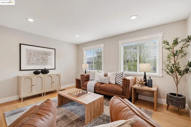 a living room with furniture rug and window
