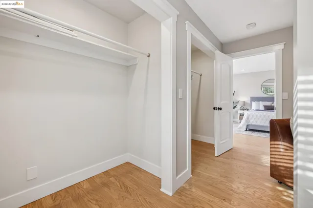 a view of balcony with wooden floor and seating space