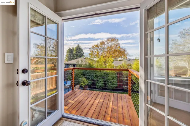 a bedroom with a large bed and a large window