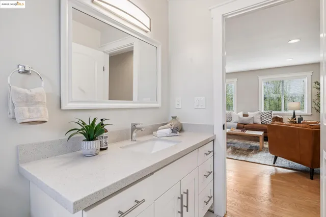 a bedroom with a bed and a potted plant
