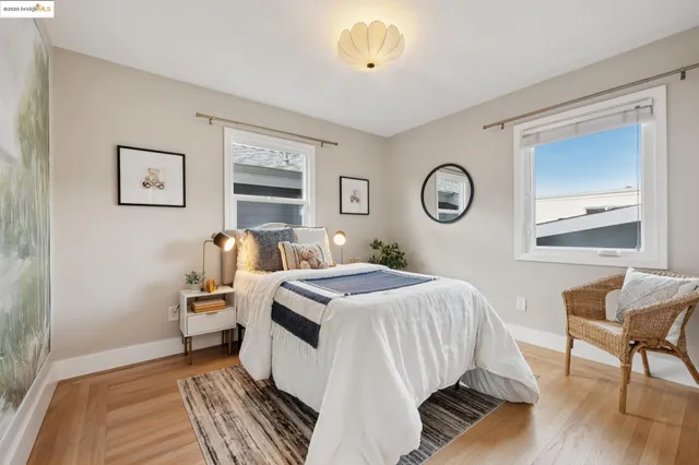 a bathroom with a granite countertop sink a toilet and mirror
