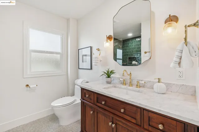 a dining room with furniture and a window