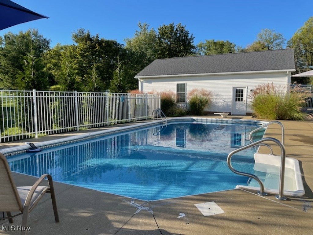 7300 Darrow Road Hudson, OH 44236 - Photo 39 of 44 View of swimming pool with a patio area