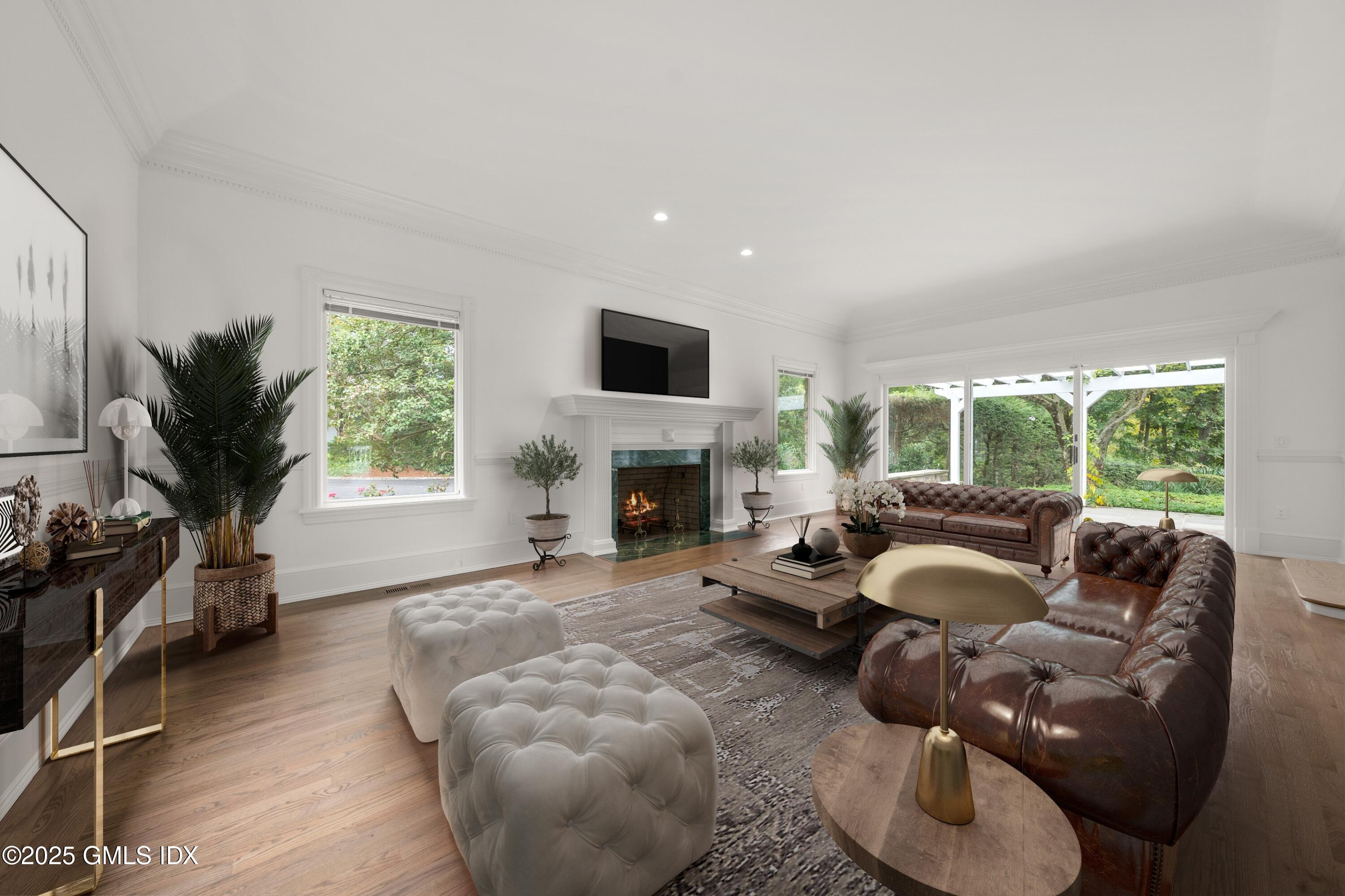 21 Harkim Road Greenwich, CT 06831 - Photo 11 of 40 a living room with furniture and a fireplace
