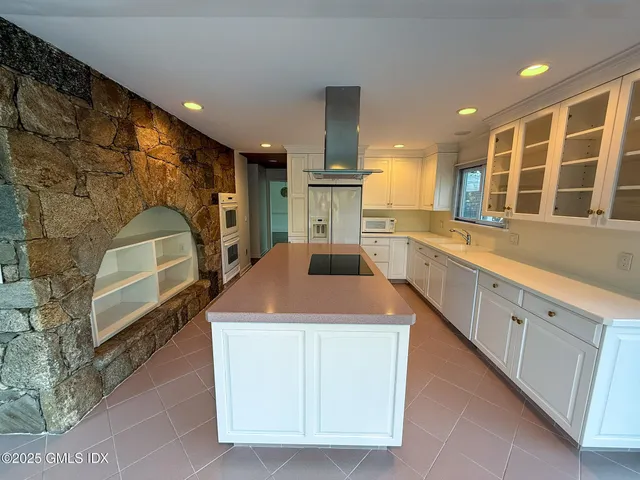 a dining room with furniture a window and a chandelier