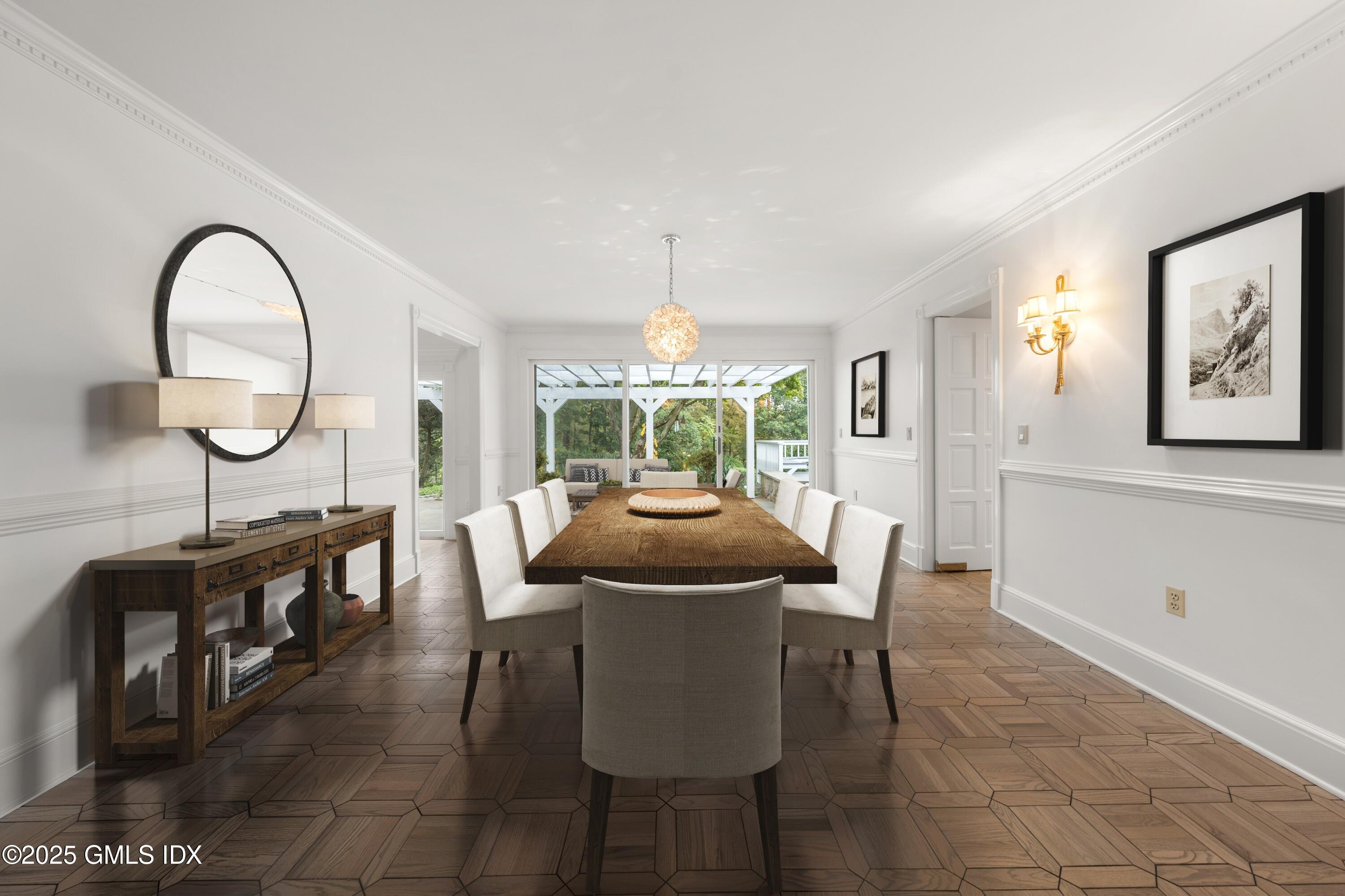 21 Harkim Road Greenwich, CT 06831 - Photo 17 of 40 a dining room with furniture a window and a chandelier
