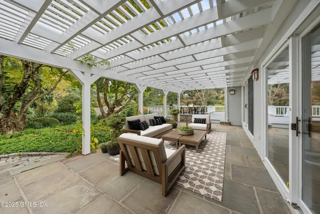 a view of a living room and chandelier