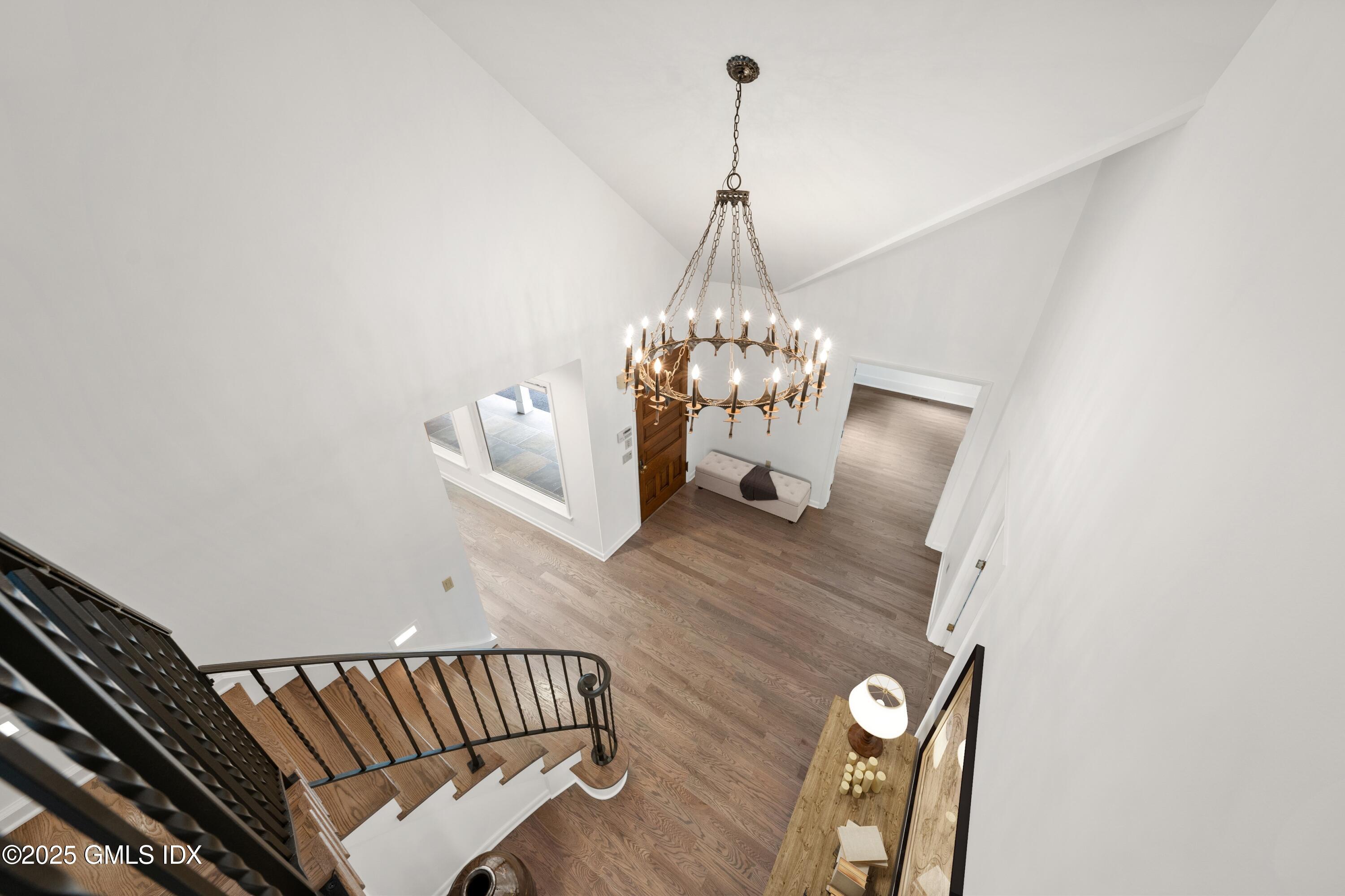 21 Harkim Road Greenwich, CT 06831 - Photo 23 of 40 a view of a living room and chandelier