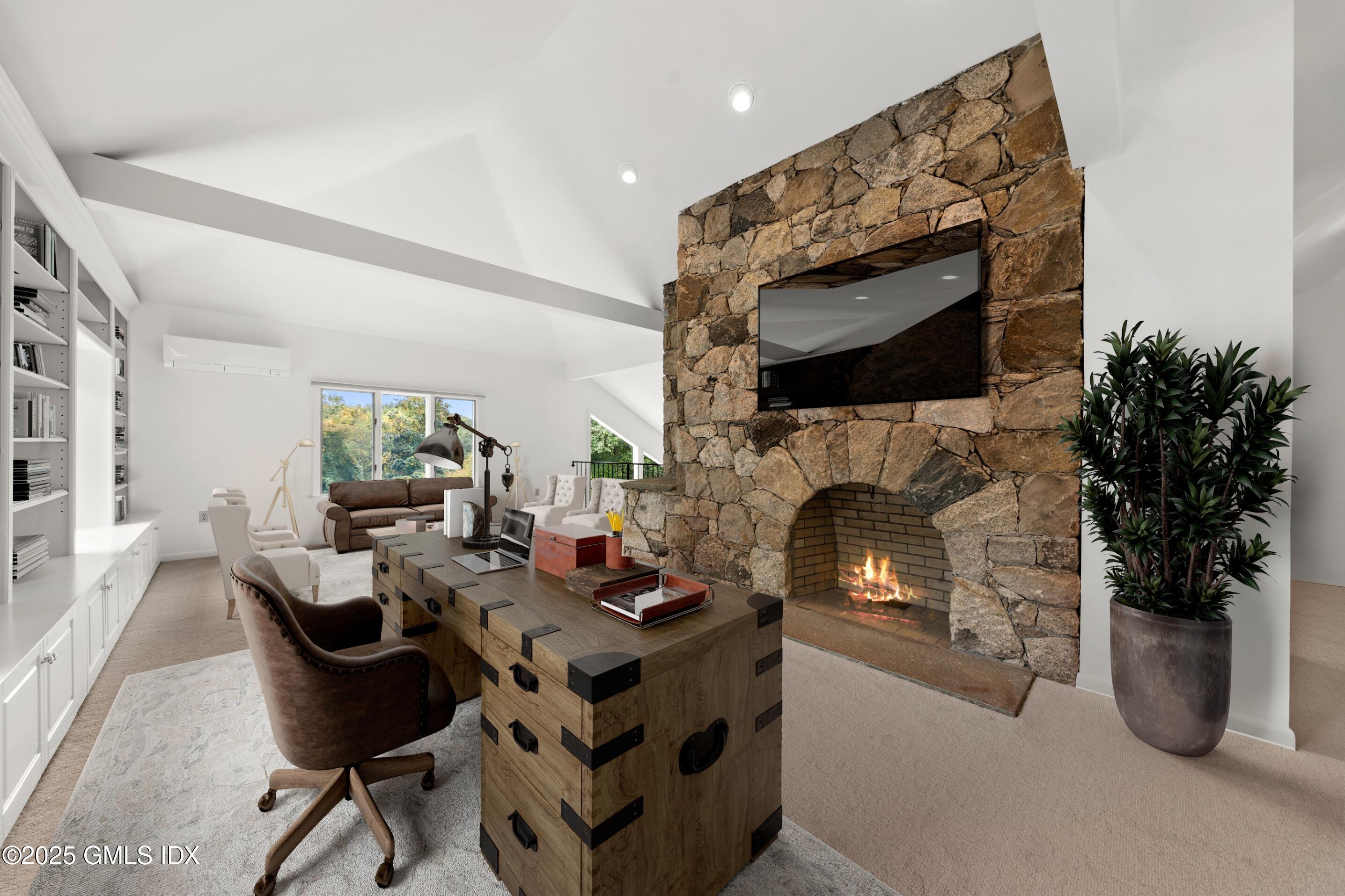 21 Harkim Road Greenwich, CT 06831 - Photo 25 of 40 a living room with furniture a fireplace and potted plants