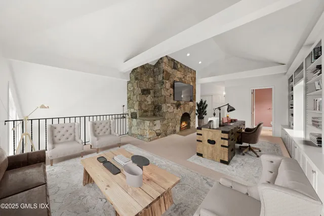 a bedroom with furniture and a window