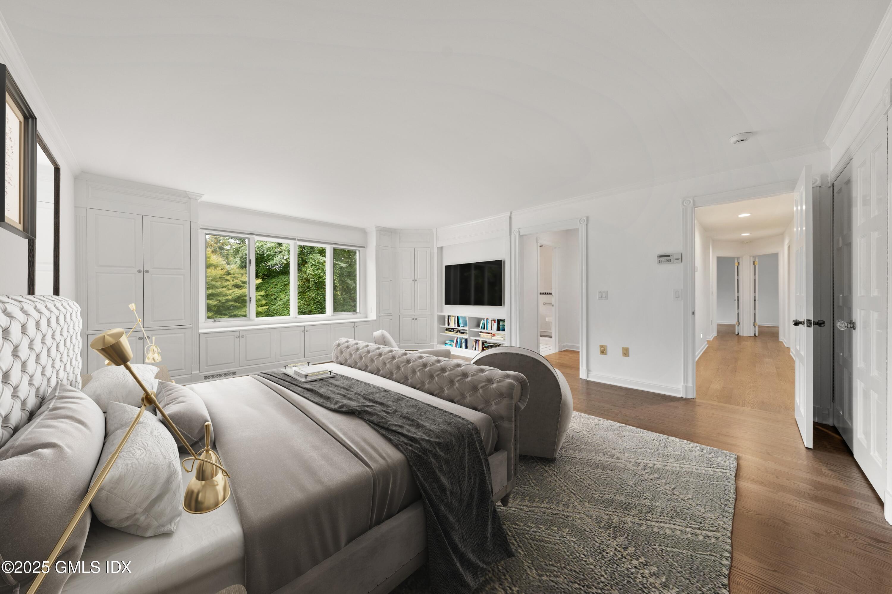 21 Harkim Road Greenwich, CT 06831 - Photo 27 of 40 a bedroom with a bed and a couch